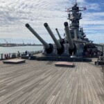 From the bow, looking back towards the bridge. These guns were huge. One of the shells that they fired is positioned on the cart just in front of the left lower gun. What was interesting is that even when they refitted and modernized the ship in the mid 80s they did not change the firing equipment from the 1920s. They was nothing available that would work any better. Battleship Missouri - 16" Guns