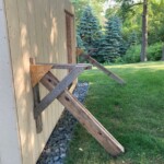 Here is a picture of the scaffolding I built to enable us to work on the roof. I plank is put between the stanchions. Scaffolding