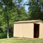 A picture of the shed with the, eves and drip edge installed. Finished Roof Structure