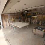 After measuring, I then cut off the bottom edge of the door. Cutting door.