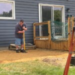 Cary is packing the crushed limestone. Once it gets wet it will set up pretty hard. Packing