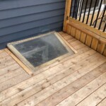 I used a simple frame around the egress window to inhibit the dogs from trying to catch mice plus it looks better. "Picture" frame around egress window.