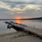 Sunset over the dock and boats. Trout Lake Sunset