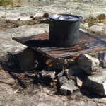 Pot over fire for fish boil Pot over fire